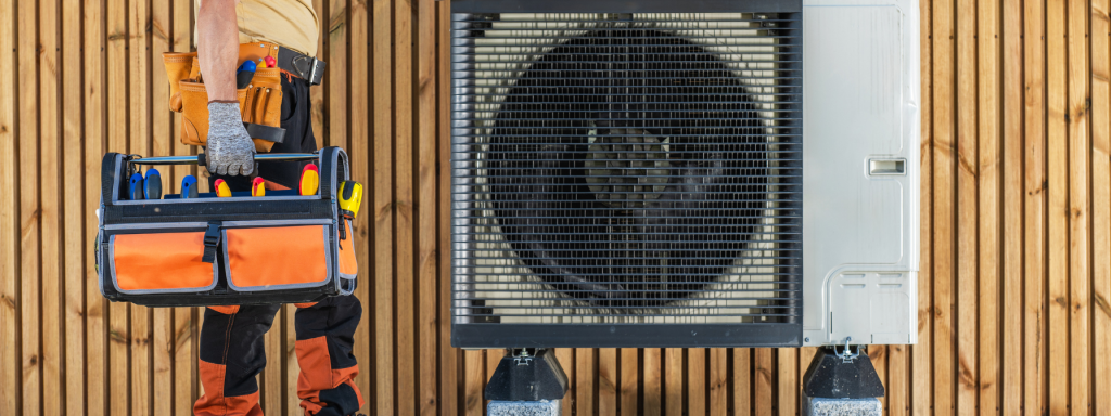 HVAC technician standing beside an outdoor air conditioning unit, holding a tool bag with essential repair tools. The image emphasizes professional HVAC maintenance, air conditioning repair services, and the importance of regular equipment servicing for optimal performance.